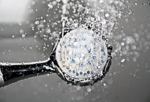 Water flowing from shower head.