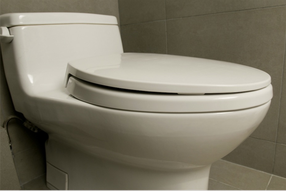 white toilet in residential bathroom
