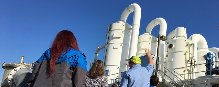 Middle schoolers filter through water treatment plant